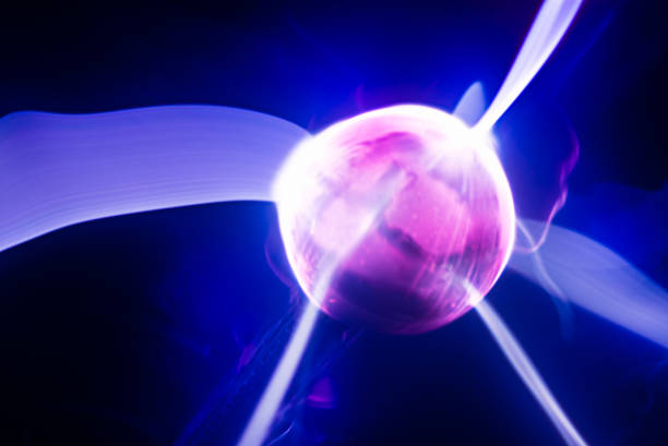 istock abstract glowing ball of pink color with rays emanating from it in blue space 1296752076