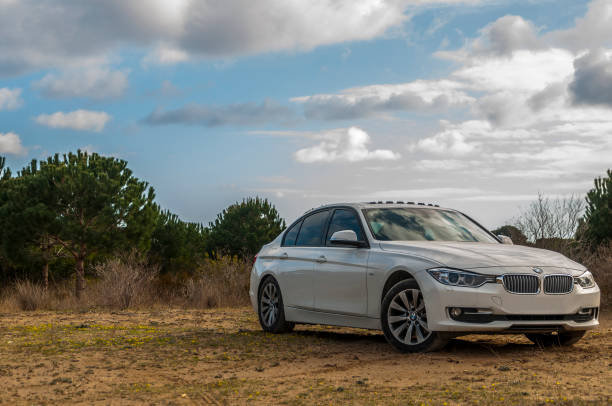 Antalya, Turkey - February 24, 2017: BMW F30 3-series is parked in the forest sand.