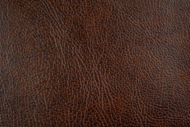 istock brown leather with visible details. background or texture 1296755408