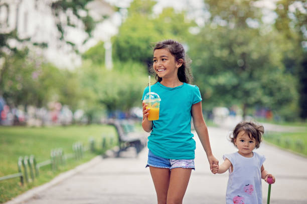 istock Sisters are walking in a city 1296756242