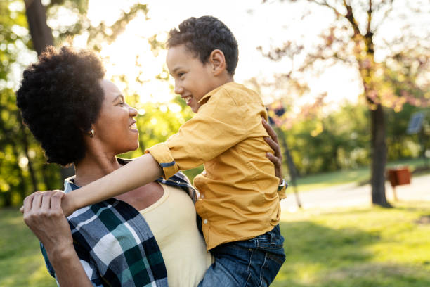 istock Mother holds her little boy 1296756850