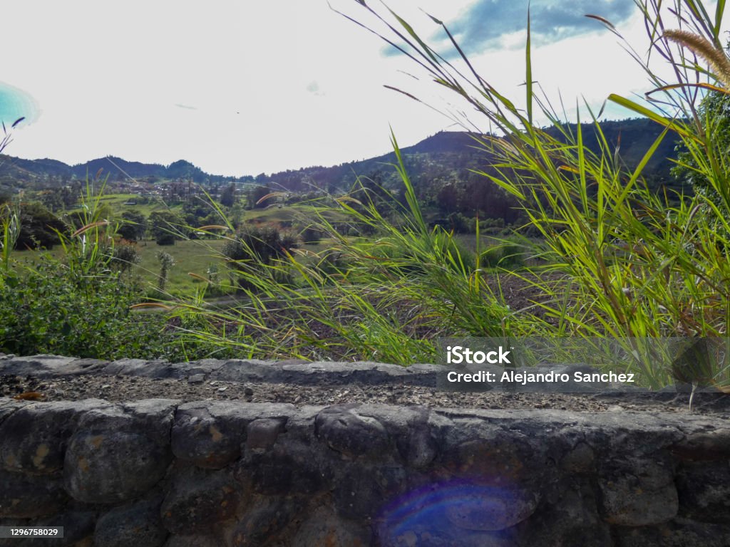 Rock wall after a sown Wall made of rock in a sown after a mountain landscape. Backgrounds Stock Photo