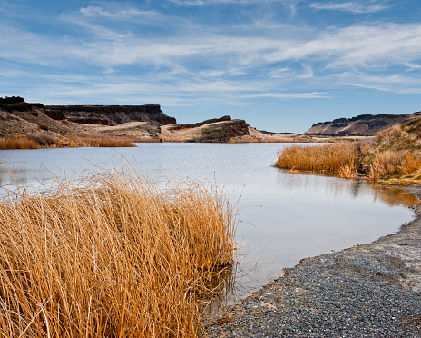 There are many pothole lakes and ponds in the scablands of Central Washington.  Corral Lake is in the Columbia National Wildlife Refuge near Othello, Washington State, USA.