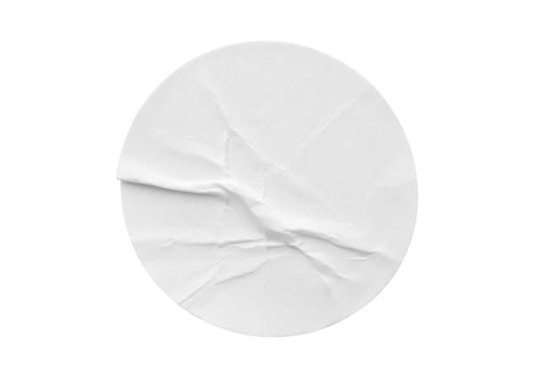 istock Blank white round paper sticker label isolated on white background 1296760653