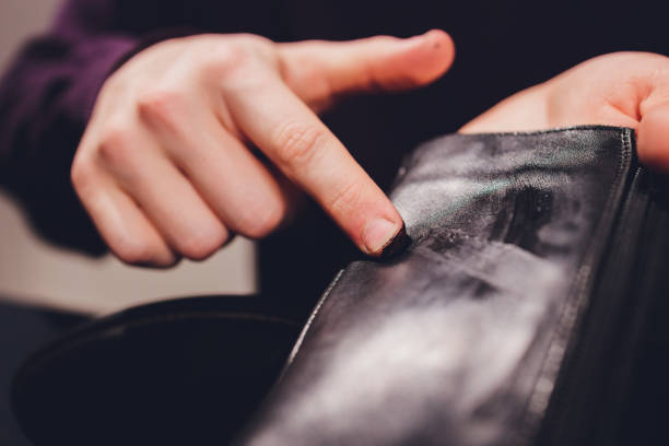 istock boots. applying cream with your finger. Shoe repair. 1296761631