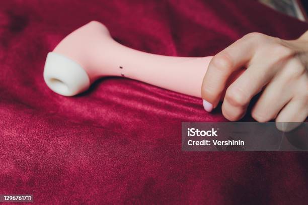 Woman In Bedroom Holding Vibrator In Hand Stock Photo - Download Image Now - Vibrator, One Woman Only, Holding