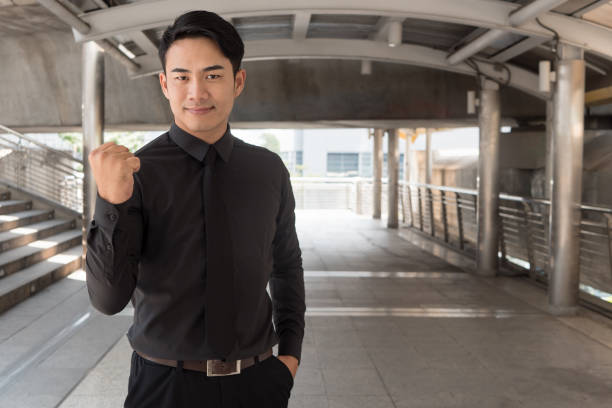 istock confident, strong, successful asian businessman 1296761989