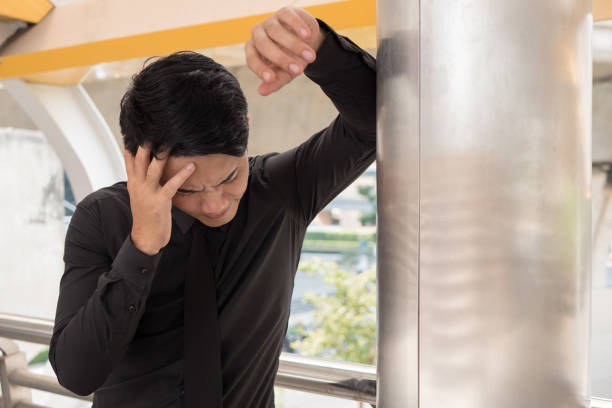 istock sick businessman suffering from stress, headache, vertigo, migraine, emotional problem 1296762024