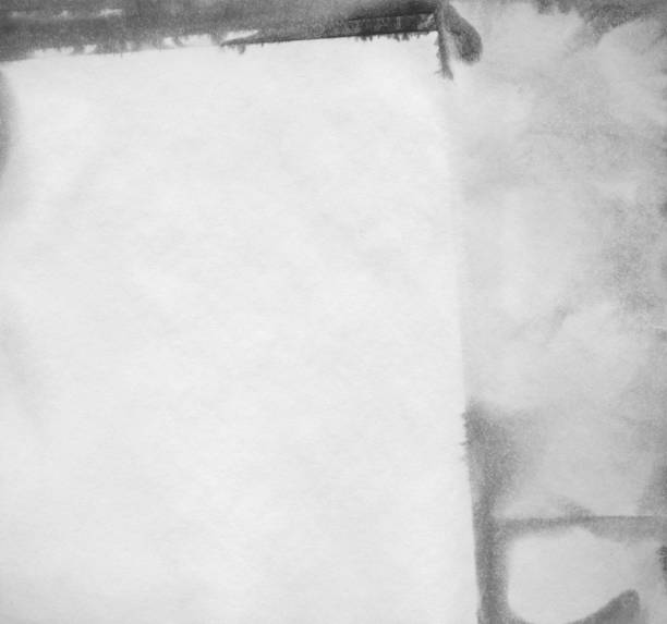 istock Dampened And Stained White Paper Grunge Texture Full Frame Background 1296762564