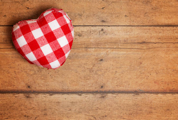 istock Plaid Love Hearts on a Rustic Wooden Background 1296763080