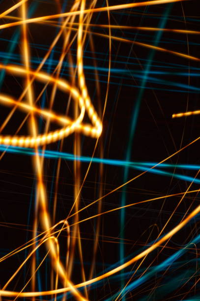 istock Water threads on black background - abstract graphic background showing azure irregular lines and chaotic ribbons. 1296763143