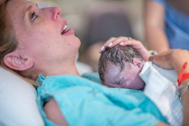 istock A new mother holding her baby for the first time 1296764687