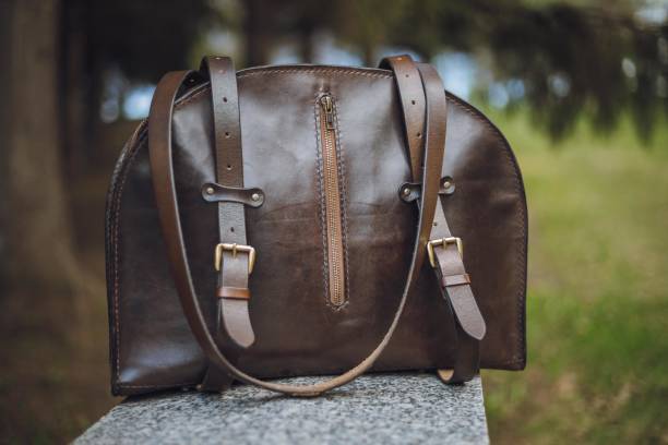 istock Stylish Backpack and sunglasses on green grass. 1296767240