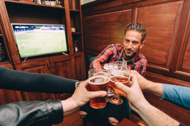 istock Beer and soccer at the pub 1296774937