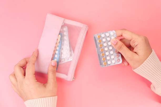 women hand golding birth control pills close up women hand golding birth control pills close up . contraceptive photos stock pictures, royalty-free photos & images