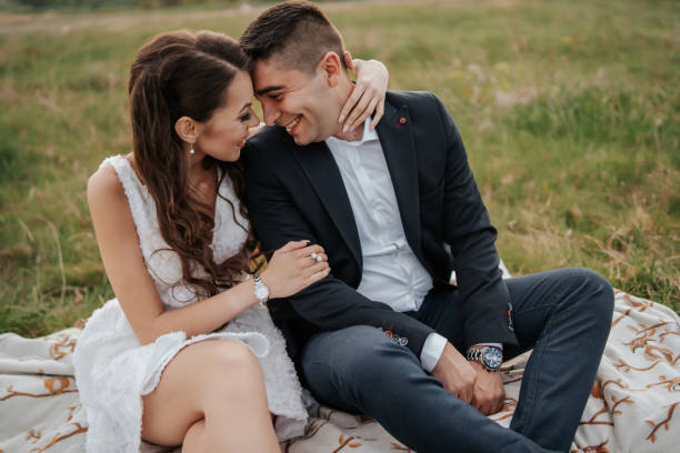 istock Romantic couple enjoying on meadow 1296780393