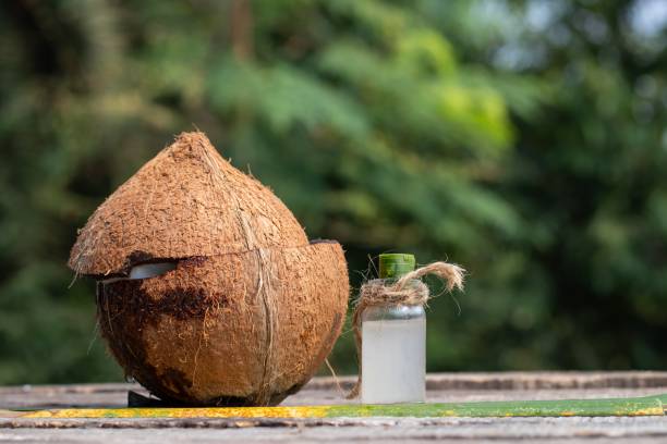 istock Organic Coconut and Coconut Water in a Small Glass Jar with Copy Space 1296786464