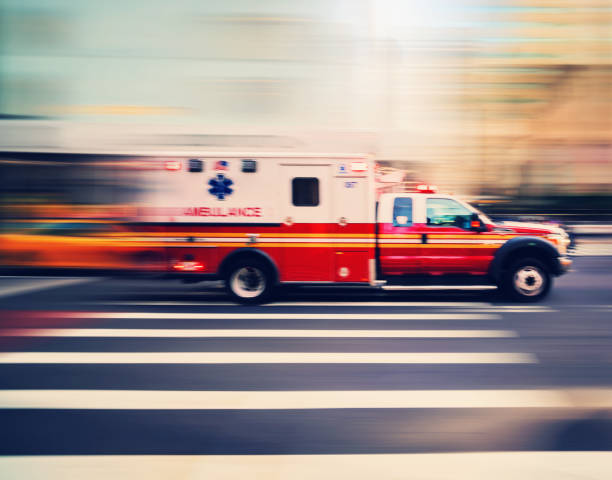 Ambulance speeding in New York Ambulance speeding in New York ambulance stock pictures, royalty-free photos & images