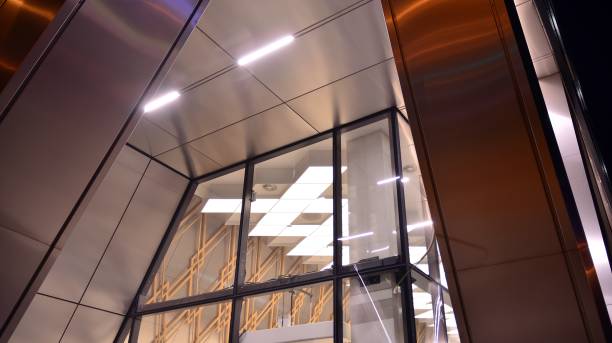 istock Pattern of office buildings windows illuminated at night. 1296794301