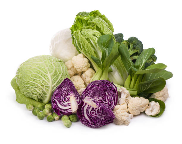 istock Group of green vegetables on white background 1296798818