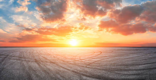 istock Race track road and sky clouds at sunset. 1296799506