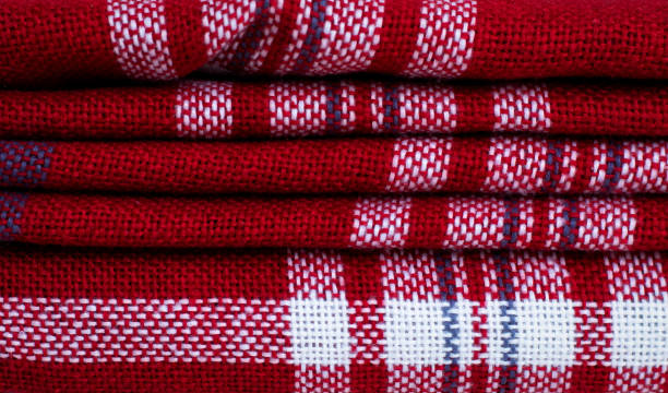 istock Texture of a red plaid. Red gingham fabric close up. Knitted plaid plaid. 1296801371