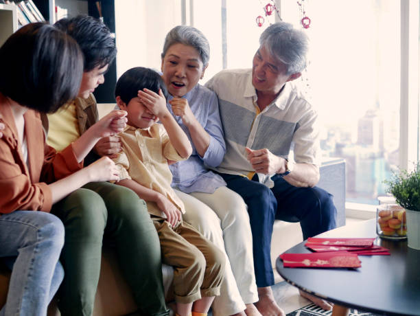 istock Playful grandchild during Chinese New Year gathering 1296803404