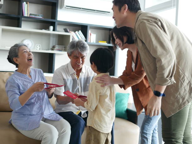 istock Grandmother is laughing during Chinese New Year celebration 1296803453