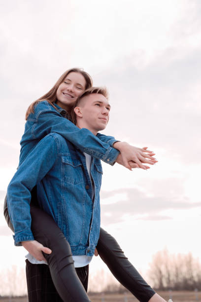 istock Young loving couple embracing each other outdoors in the park 1296805629