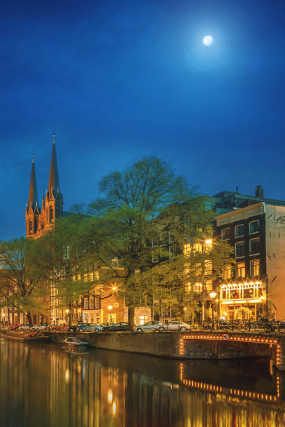 istock Amsterdam in the night with the Krijtberg Kerk (St. Francis Xavier Church) 1296806659