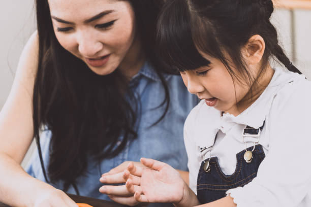 istock Asia Child girl playing with her mom 1296806718