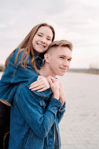 istock Young loving couple embracing each other outdoors in the park 1296806806