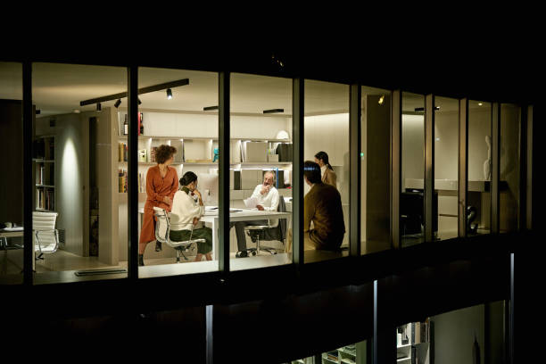 istock Designers Working Late and Brainstorming Project Plans 1296811886