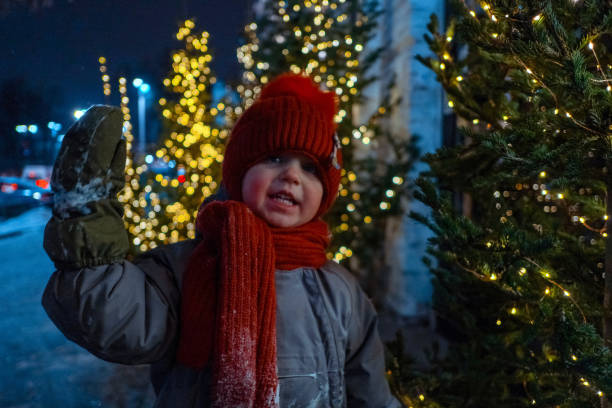 istock Kid enjoying winter holidays on street 1296812044
