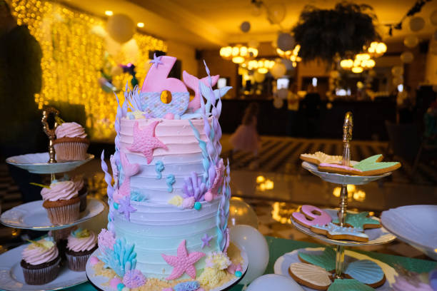 istock Festive cake with number 6 on banquet table 1296812051