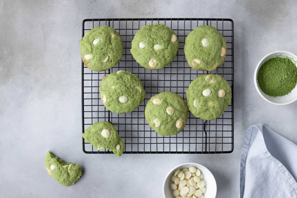 flat lay composition with green tea matcha cookies on cooling rack