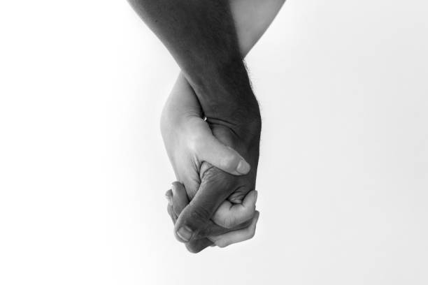 istock Anti racism and protest. White, black couple holding hands 1296814084