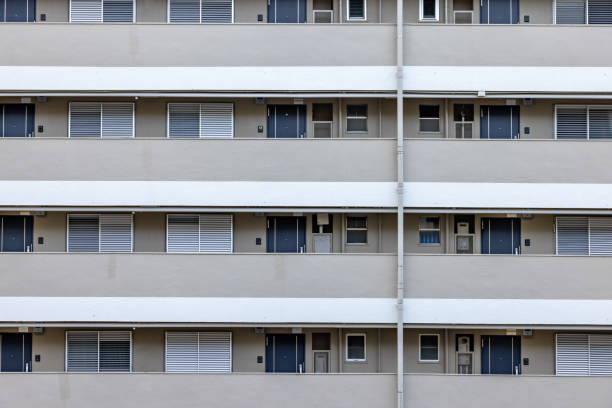 istock Apartment house with many doors and windows 1296814191