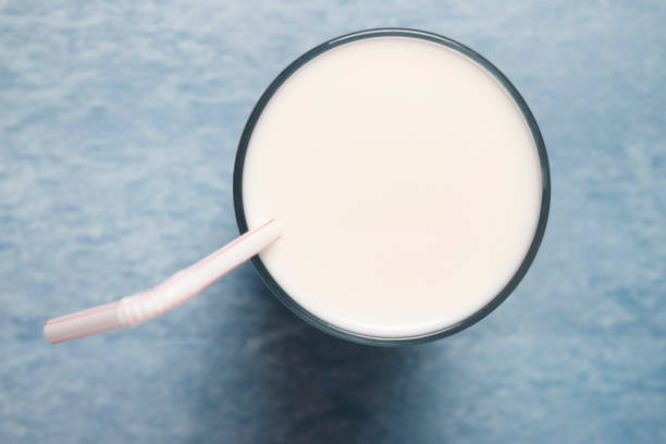 istock full glass of milk with straw 1296816508