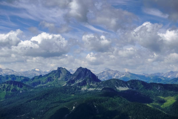 istock two peaks from mountains in a wonderful landscape with clouds 1296817396