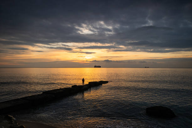 relaxing in beautiful landscape on pier at sunset