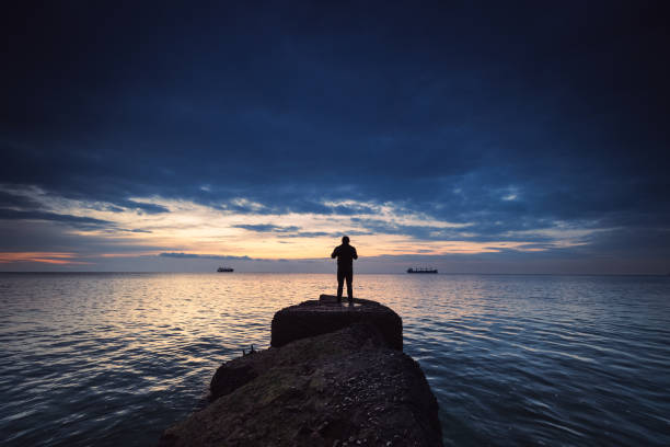 relaxing in beautiful landscape on pier at sunset