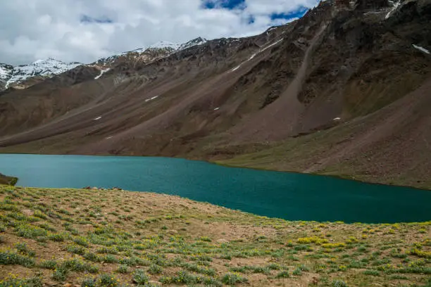 Tso Chikgma or Chandra Taal, or Chandra Tal is a lake in the Lahaul part of the Lahul and Spiti district of Himachal Pradesh. Chandra Taal is near the source of the Chandra River. Despite the rugged and inhospitable surroundings, it is in a protected niche with some flowers and wildlife in summer.