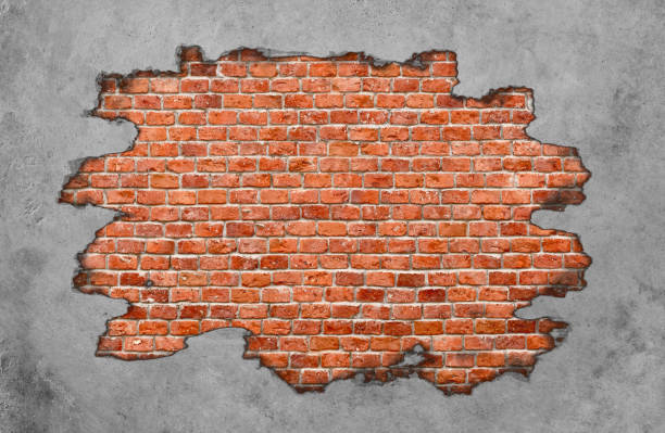 istock Red brick wall under the damaged concrete wall 1296819820