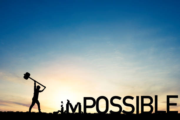 Mindset concept ,Silhouette  man smashed with a hammer to destroy impossible to possible  wording on blue sky and sunlight. Mindset concept ,Silhouette  man smashed with a hammer to destroy impossible to possible  wording on blue sky and sunlight. impossible possible stock pictures, royalty-free photos & images