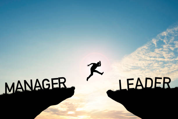 istock Silhouette Man jumping from Manager cliff to leader cliff on cloud and blue sky. Change behaviour and mindset to Leadership concept 1296820107