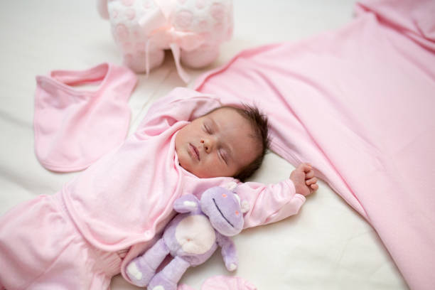 istock Sleeping Newborn Baby Girl 1296823710
