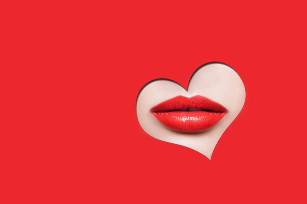 istock Beautiful woman red lips through red heart shape. 1296824638