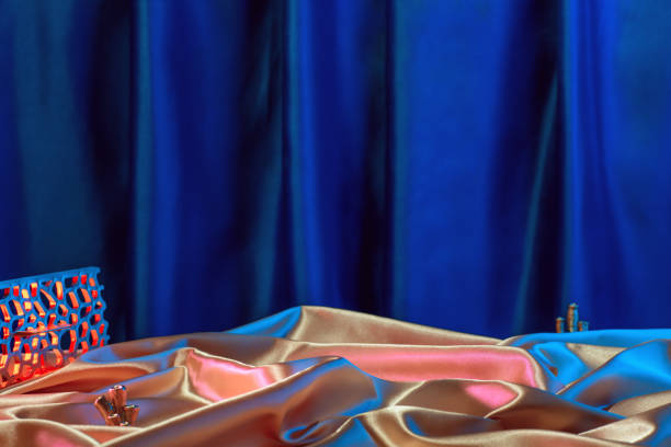 Retro ocean themed composition with coral reefs and holographic fabrics, abstract background.