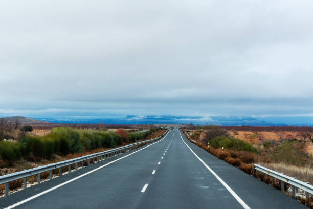 istock Lost highway on the horizon. 1296828522